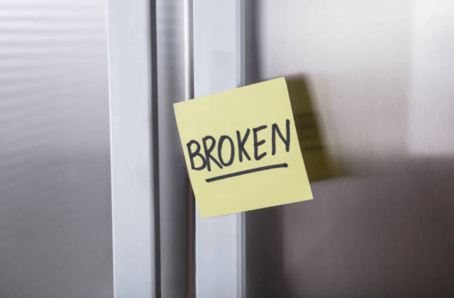 refrigerator with a broken sign